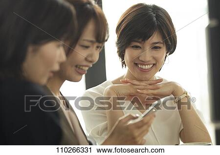 Japanese women at a cafe View Large Photo Image Stock Image - Japanese women at a cafe. Fotosearch