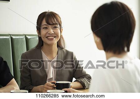 Stock Photography - Japanese women at a cafe. Fotosearch