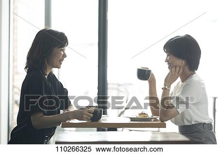 Stock Photography - Japanese women at a cafe. Fotosearch