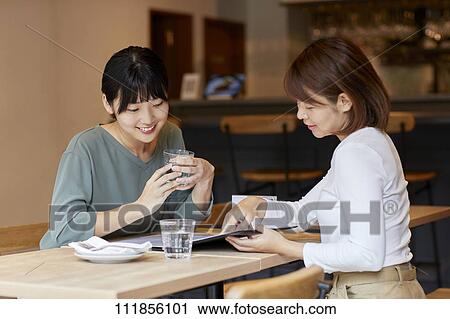 Japanese women at a restaurant View Large Photo Image Stock Image - Japanese women at a restaurant. Fotosearch