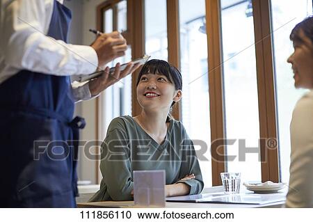 Japanese women at a restaurant View Large Photo Image Stock Image - Japanese women at a restaurant. Fotosearch