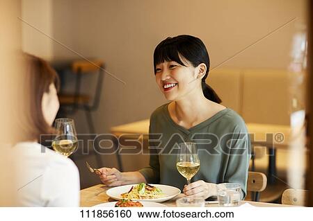 Japanese women at a restaurant View Large Photo Image Stock Image - Japanese women at a restaurant. Fotosearch