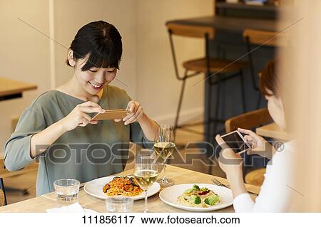 Japanese women at a restaurant View Large Photo Image Stock Photo - Japanese women at a restaurant. Fotosearch