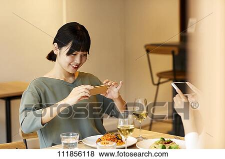 Japanese women at a restaurant View Large Photo Image Stock Photo - Japanese women at a restaurant. Fotosearch
