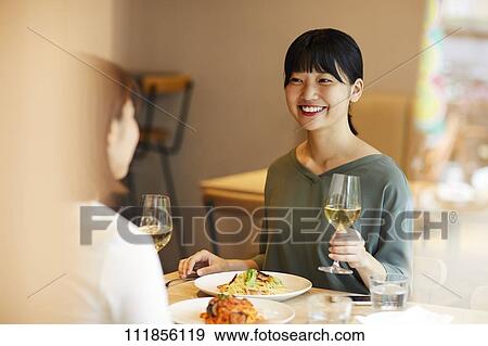Stock Photo - Japanese women at a restaurant. Fotosearch