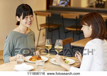 Japanese women at a restaurant View Large Photo Image Stock Photograph - Japanese women at a restaurant. Fotosearch