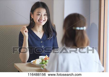 Stock Photograph - Japanese women at a restaurant. Fotosearch