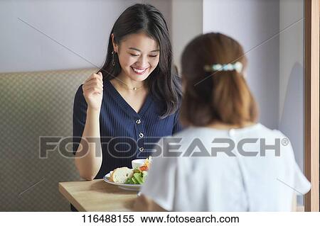 Stock Photography - Japanese women at a restaurant. Fotosearch