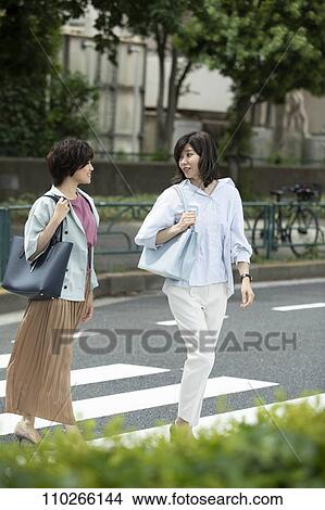 Picture - Japanese women downtown. Fotosearch
