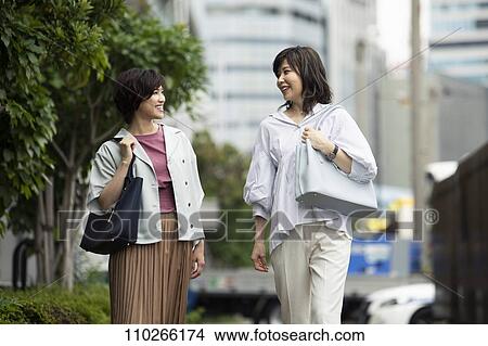 Picture - Japanese women downtown. Fotosearch