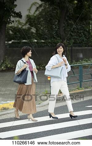 Japanese women downtown View Large Photo Image Stock Photograph - Japanese women downtown. Fotosearch
