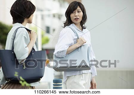 Stock Photography - Japanese women downtown. Fotosearch