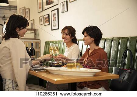 Japanese women happily dining together View Large Photo Image Stock Image - Japanese women happily dining together. Fotosearch