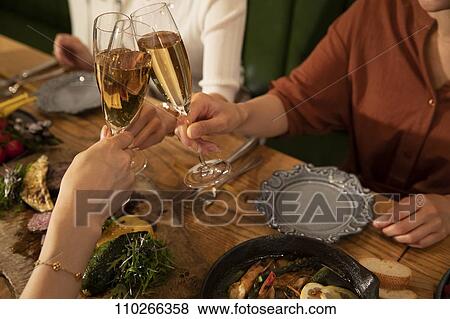 Stock Photo - Japanese women happily dining together. Fotosearch