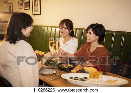 Japanese women happily dining together View Large Photo Image Stock Photograph - Japanese women happily dining together. Fotosearch