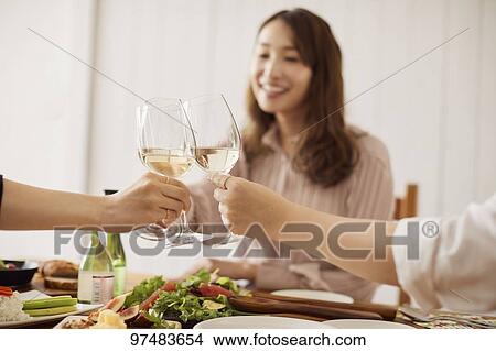 Picture - Japanese women having home party. Fotosearch