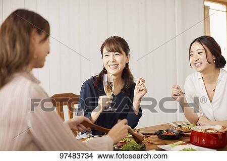 Japanese women having home party View Large Photo Image Picture - Japanese women having home party. Fotosearch