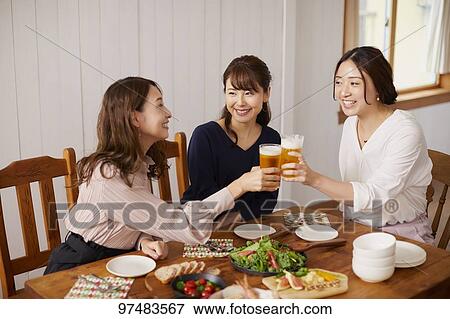 Japanese women having home party View Large Photo Image Stock Photo - Japanese women having home party. Fotosearch