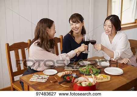 Japanese women having home party View Large Photo Image Stock Photo - Japanese women having home party. Fotosearch