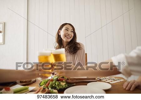 Stock Photo - Japanese women having home party. Fotosearch