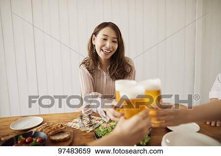 Stock Photo - Japanese women having home party. Fotosearch