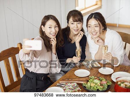 Japanese women having home party View Large Photo Image Stock Photo - Japanese women having home party. Fotosearch