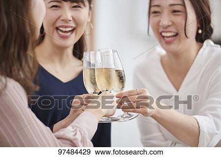 Stock Photo - Japanese women having home party. Fotosearch