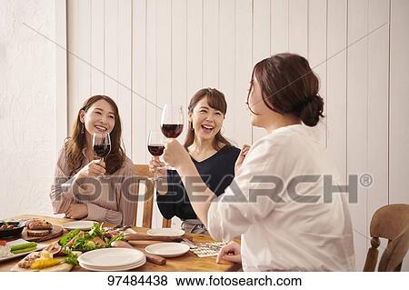 Japanese women having home party View Large Photo Image Stock Photo - Japanese women having home party. Fotosearch