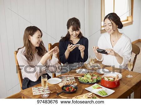 Japanese women having home party View Large Photo Image Stock Photograph - Japanese women having home party. Fotosearch