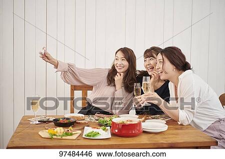 Japanese women having home party View Large Photo Image Stock Photograph - Japanese women having home party. Fotosearch