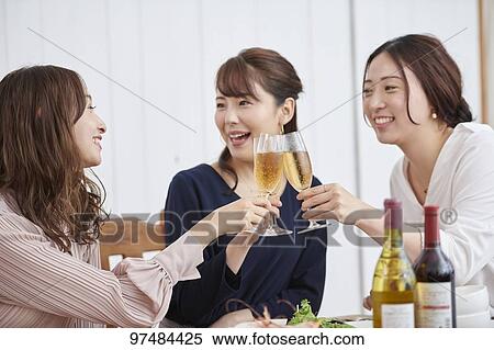Stock Photography - Japanese women having home party. Fotosearch
