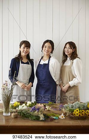 Picture - Japanese women with flowers. Fotosearch