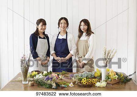 Stock Image - Japanese women with flowers. Fotosearch