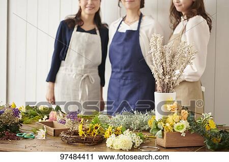 Japanese women with flowers View Large Photo Image Stock Image - Japanese women with flowers. Fotosearch