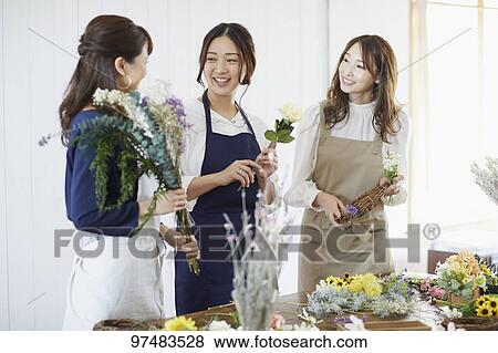 Japanese women with flowers View Large Photo Image Stock Photo - Japanese women with flowers. Fotosearch