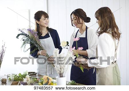 Stock Photo - Japanese women with flowers. Fotosearch