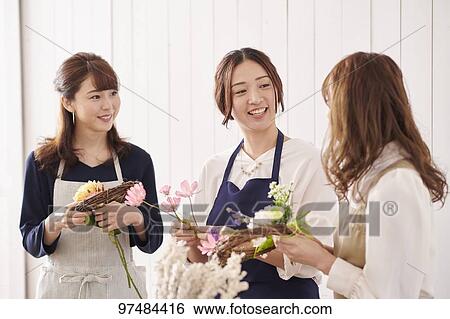 Japanese women with flowers View Large Photo Image Stock Photograph - Japanese women with flowers. Fotosearch