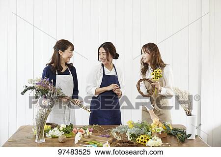 Stock Photography - Japanese women with flowers. Fotosearch