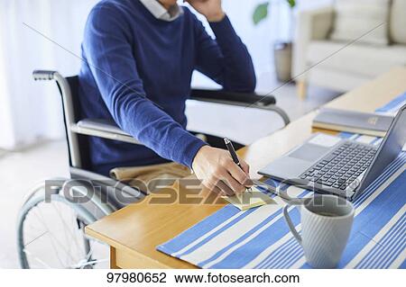 Japanese young man on wheelchair working from home View Large Photo Image Stock Image - Japanese young man on wheelchair working from home. Fotosearch