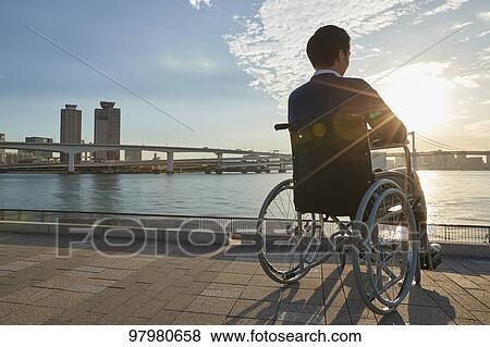 Japanese young man on wheelchair View Large Photo Image Stock Photo - Japanese young man on wheelchair. Fotosearch