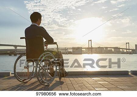 Japanese young man on wheelchair View Large Photo Image Stock Photograph - Japanese young man on wheelchair. Fotosearch