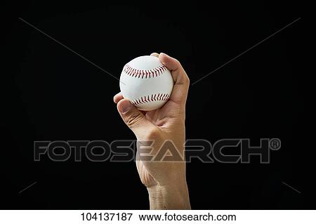 Male hand holding baseball ball View Large Photo Image Stock Photo - Male hand holding baseball ball. Fotosearch