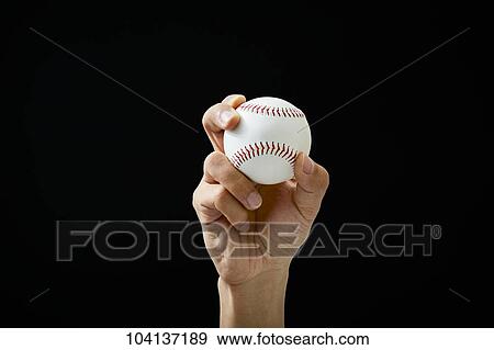 Stock Photo - Male hand holding baseball ball. Fotosearch