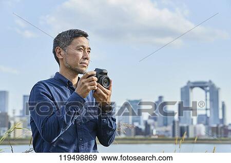 Mature Japanese man downtown Osaka, Japan View Large Photo Image Stock Photo - Mature Japanese man downtown Osaka, Japan. Fotosearch