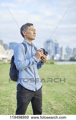 Mature Japanese man downtown Osaka, Japan View Large Photo Image Stock Photo - Mature Japanese man downtown Osaka, Japan. Fotosearch
