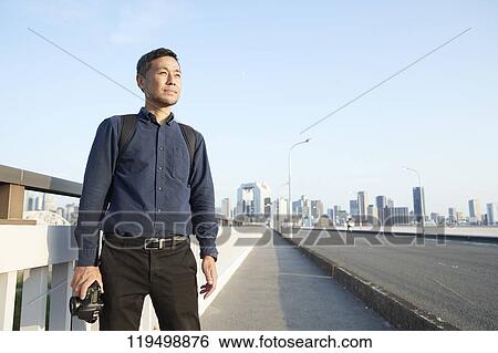 Mature Japanese man downtown Osaka, Japan View Large Photo Image Stock Photograph - Mature Japanese man downtown Osaka, Japan. Fotosearch