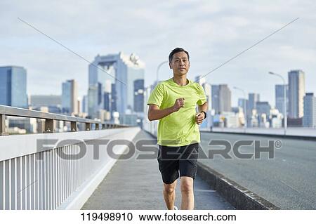Mature Japanese man running downtown Osaka, Japan View Large Photo Image Stock Image - Mature Japanese man running downtown Osaka, Japan. Fotosearch