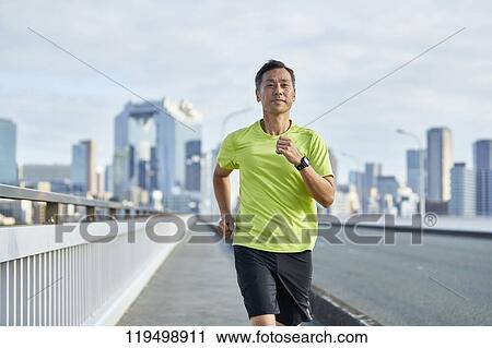 Mature Japanese man running downtown Osaka, Japan View Large Photo Image Stock Image - Mature Japanese man running downtown Osaka, Japan. Fotosearch