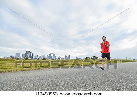 Mature Japanese man running downtown Osaka, Japan View Large Photo Image Stock Image - Mature Japanese man running downtown Osaka, Japan. Fotosearch