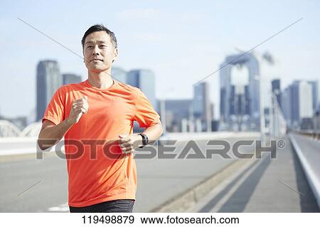 Mature Japanese man running downtown Osaka, Japan View Large Photo Image Stock Photo - Mature Japanese man running downtown Osaka, Japan. Fotosearch